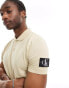 Calvin Klein Jeans badge polo shirt in beige