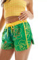 Labelrail x Olivia Grace Herring hibiscus print low rise shorts in green