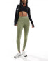 New Balance Linear Logo sleek 25 inch high rise leggings in olive green