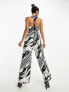 River Island halterneck tie back wide leg jumpsuit in black and white