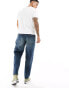 ASOS DESIGN tapered jeans in dark wash blue