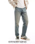 ASOS DESIGN tapered fit jeans in mid wash blue with tint