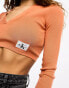 Calvin Klein Jeans label tight crop v-neck sweater in burnt clay