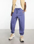 ASOS DESIGN oversized joggers in navy with collegiate multiplacement print