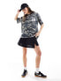 ASOS DESIGN oversized t-shirt with graphic in washed camo print