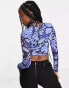 ASOS DESIGN Fuller Bust long sleeve cupped halter top in blue butterfly print