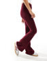 Bershka high waisted sculpting jersey flared trousers in burgundy