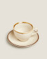 Porcelain teacup with antique finish rim