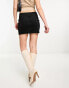 Weekday minimal scuba mini skirt in black