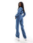 In The Style long sleeve denim jumpsuit in blue