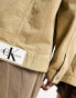 Calvin Klein Jeans Unisex extreme oversized denim jacket in beige - exclusive to ASOS