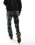 Kavu teannastay co-ord fleece joggers in green with all over geometric print