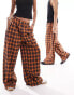 COLLUSION Unisex check wide leg trousers in orange