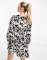 New Look v neck bell sleeve mini dress in black and white print