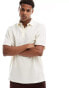 ASOS DESIGN relaxed waffle polo shirt in beige