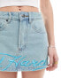 Ed Hardy micro denim mini skirt with blue embroidery and dragon bum