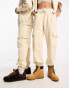 Calvin Klein Jeans unisex cargo joggers in beige - exclusive to ASOS