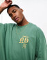 ASOS DESIGN oversized t-shirt in green with gothic text chest print