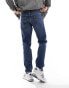 ASOS DESIGN stretch tapered jeans in mid wash blue