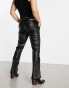 ASOS DESIGN bootcut trousers in leather look with cut out sides in black - BLACK