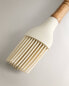 Silicone and wood brush