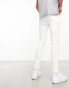 ASOS DESIGN spray on jeans with power stretch with heavy rips in white