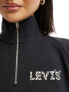 Levi's exclusive to ASOS half zip jumper in black with small leopard print logo