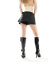 Lioness tie side skort with pocket detail in black