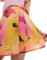 Monki mini wrap skirt with tie up side in multi hibiscus print