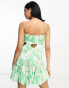 ASOS DESIGN ruched bust mini dress with tie detail and cut out in green floral print