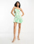 ASOS DESIGN ruched bust mini dress with tie detail and cut out in green floral print