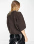 Object button through knitted top in brown