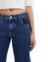 ASOS DESIGN low rise straight leg jeans with turn up in mid blue