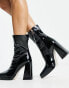 RAID Vista heeled sock boots in black vinyl