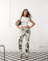 Weekday low waist straight leg trousers in cow print