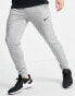 Nike Training Dri-FIT tapered joggers in light grey