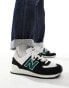 New Balance 574 trainers in black and green