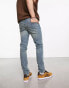 ASOS DESIGN skinny jeans with stitch detail in y2k light wash blue