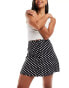 Miss Selfridge button through flippy mini skirt in black polka dot