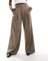 Stradivarius super wide leg pleat front trousers in beige