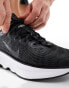 Nike Training Motiva trainers in black and white