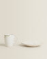 Stoneware coffee cup and saucer