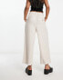 ASOS DESIGN pleated tapered trousers with linen in stone