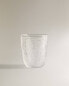 Raised design glass tumbler