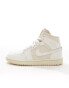 Nike Air Jordan 1 Mid trainers in off white and stone