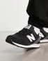 New Balance – 574 – Sneaker in Schwarz und Weiß