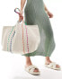 Accessorize canvas tote bag with contrast piping in off white