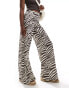 ASOS DESIGN textured wide leg trousers in zebra print