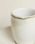 Stoneware coffee cup and saucer