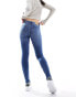 Vero Moda Alia mid rise skinny jeans with bum sculpt detail in medium blue